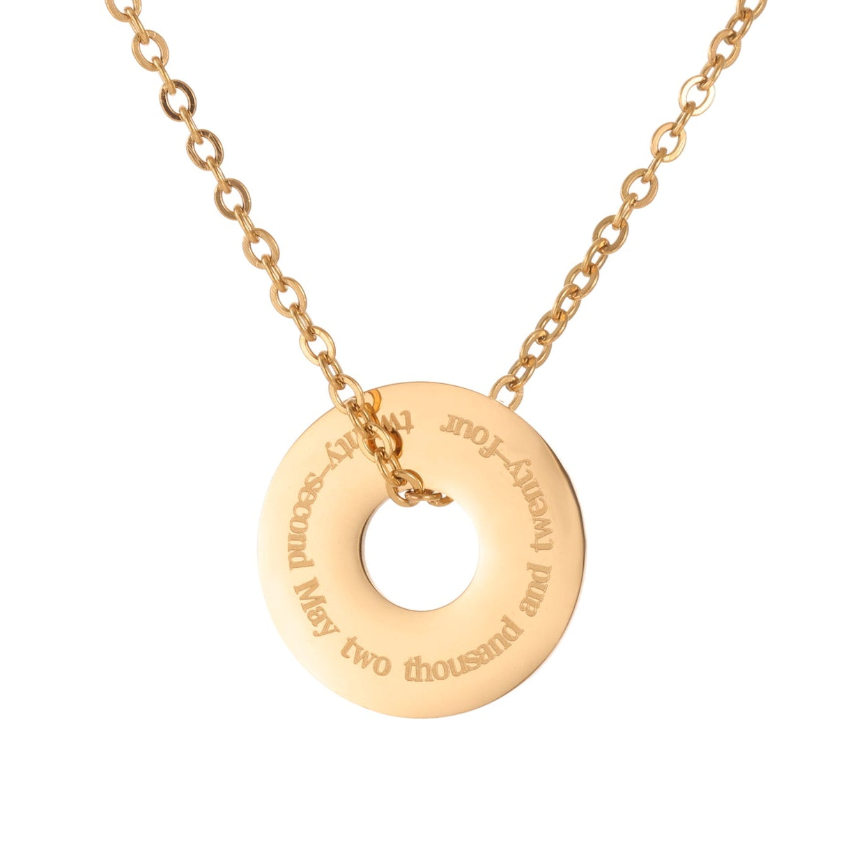 Gold necklace with a round pendant on a white background